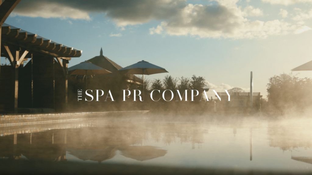 Mist rising from a pool with gazebo and umbrellas alongside. Image bears the legend "The SPA PR COMPANY.